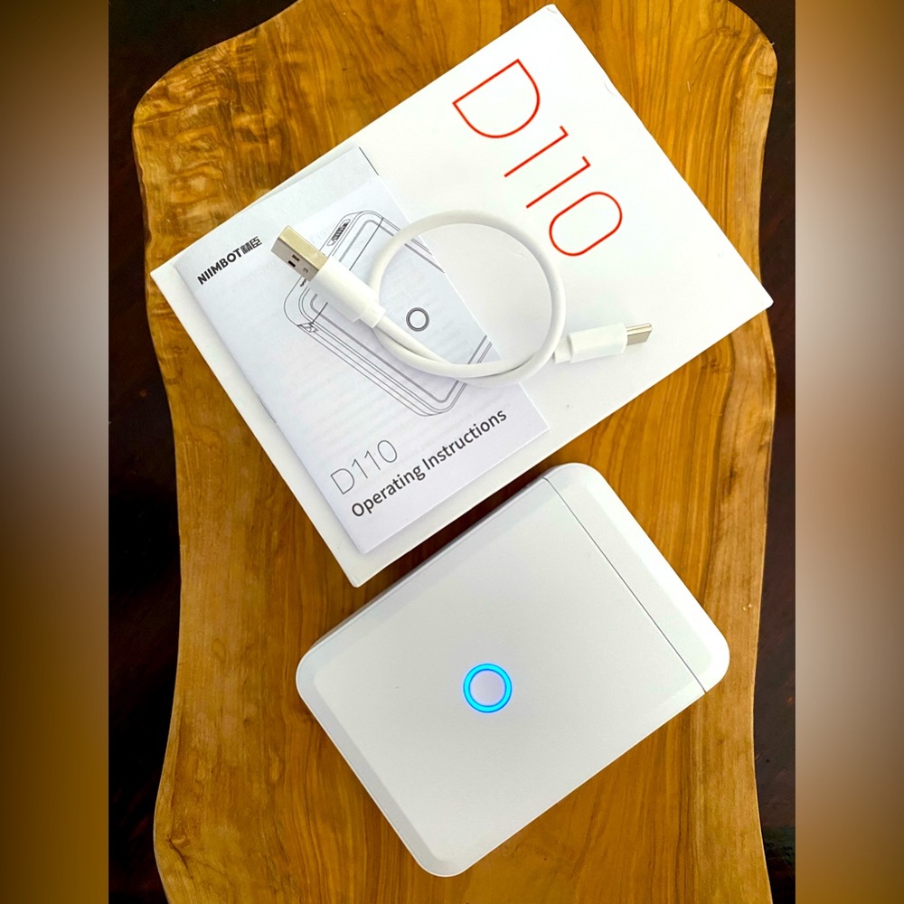 Like new NIIMBOT Thermal Label Maker with tape.